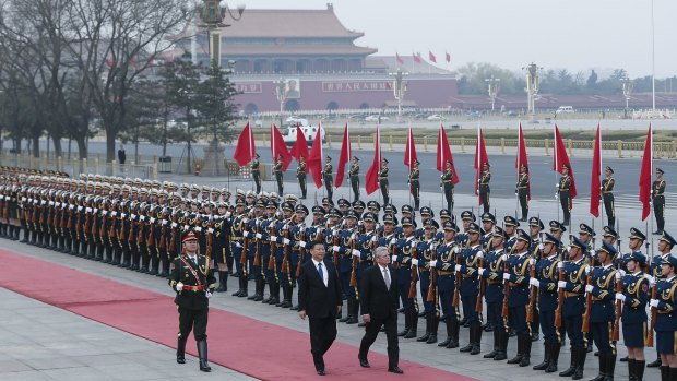 Chinese President Xi Jinping (left) accompanies German President Joachim Gauck to view an honour guard during a welcoming ceremony in the Great Hall of the People in Beijing on Monday.