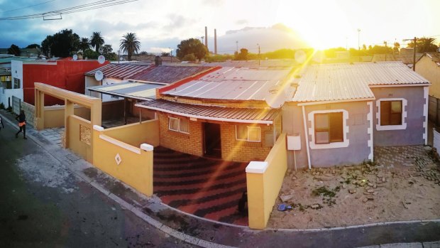 Elevated panoramic view of Cape Town Langa housing area at twilight.