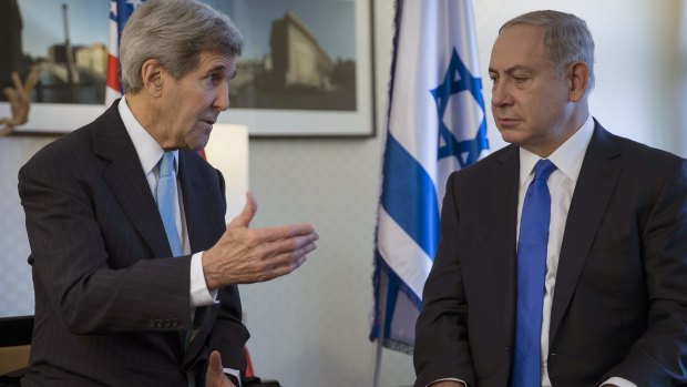 US Secretary of State John Kerry, left, speaks with Israeli Prime Minister Benjamin Netanyahu during a meeting in Berlin on Thursday.