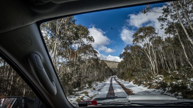 Transport Canberra and City Services Project Officer Adam Melville looks after icy or snow affected roads in the Namadgi National Park area (near the Mount Franklin chalet site).