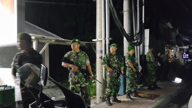 Indonesian soldiers stand guard outside Bali's Kerobokan jail after the deadly gang fight.