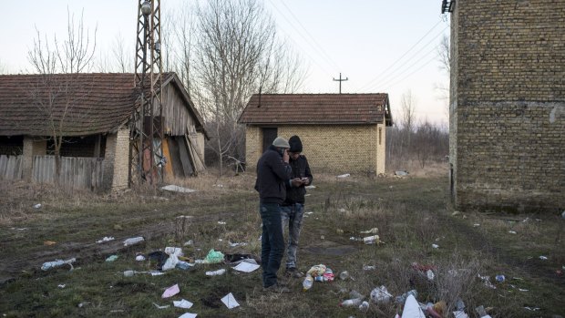 Two Afghan migrants at an abandoned brick factory in Subotica, near Serbia's border with Hungary.