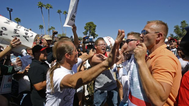 More of this to come? Trump supporters and protesters clash as Trump speaks in Fountain Hills, Arizona.