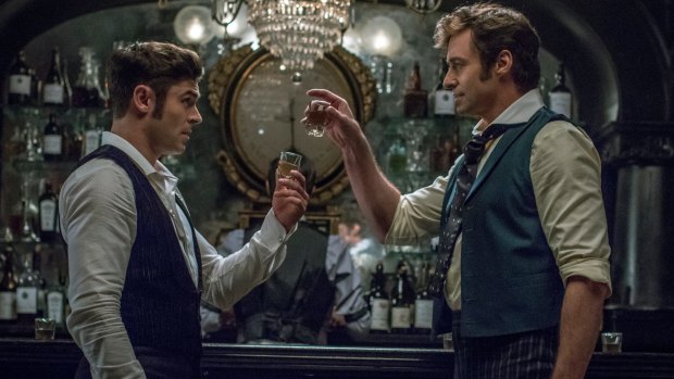 Zac Efron as Phillip Carlyle and Hugh Jackman as PT Barnum in The Greatest Showman. 