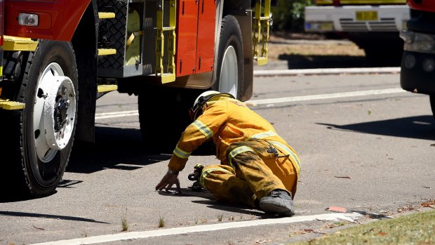 Tony Abbott joined firefighting efforts in Castle Cove but had a tumble.