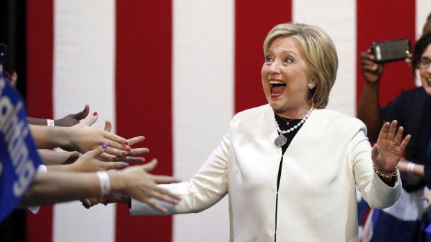 Democratic presidential candidate Hillary Clinton reacts to supporters as she arrives at her Super Tuesday election night rally in Miami.