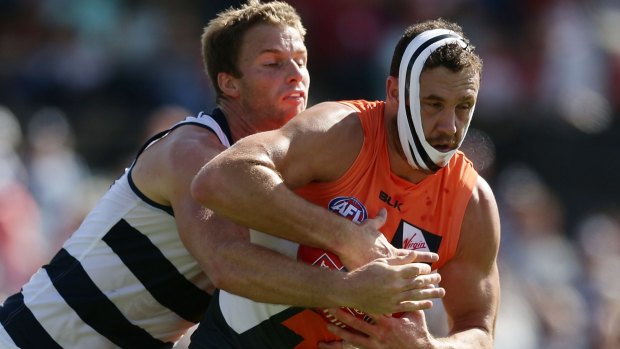 Shane Mumford of the Giants marks the ball during the round two AFL match between the Greater Western Sydney Giants and the Geelong Cats on Sunday.