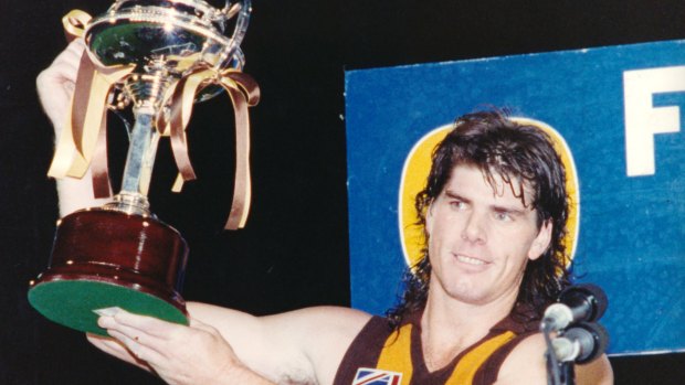 Another trophy: Yep, a Hawthorn premiership ... Gary Ayres with the 1992 Foster's Cup.