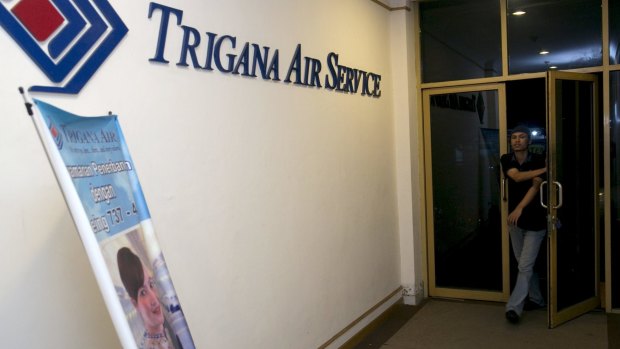 A man arrives at Trigana Air Service's office in Jakarta on Sunday evening.