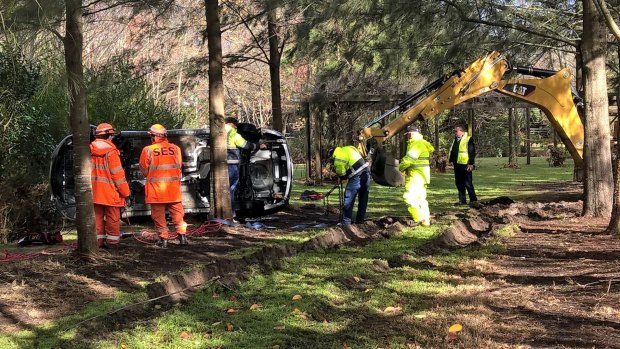 Robert Pollard's silver Mazda on its side in Bowral.