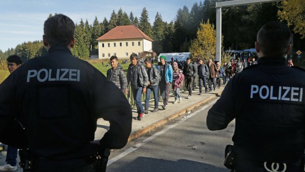Refugees cross the border from Austria near Wegscheid in Germany on Wednesday. 