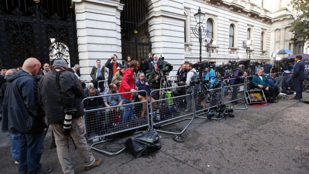 Media gather outside the home of British Prime Minister David Cameron at 10 Downing Street in London after the Brexit referendum.