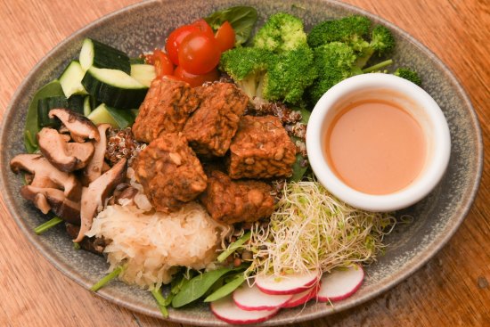 Buddha bowl with quinoa, tempeh, vegies and miso dressing.