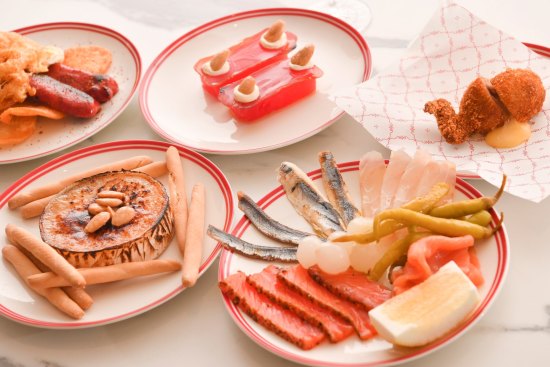 Snacks at Bar Tini (clockwise from top left): Chorizo, egg, potato; compressed watermelon, mojama, almond; Half quail; a selection of cured, smoked and pickled seafood; baked viejo maestro cheese.