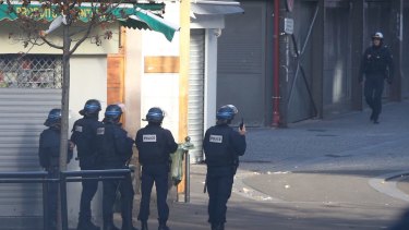 Military and police conduct an operation in Saint-Denis on Wednesday.