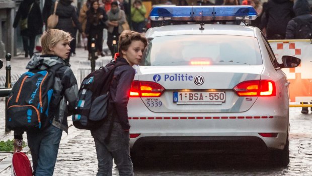 Police on patrol near a school in Brussels. Brussels is keeping its terror alert on the highest level.