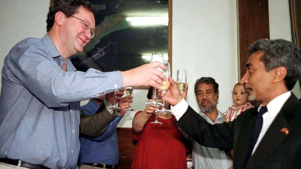 Australia's then foreign minister Alexander Downer and Mari Alkatiri, at the time East Timor's cabinet member for economic affairs and now the prime minister, pictured in 2001 after signing an agreement to share oil and natural gas revenues from drilling in the Timor Sea.