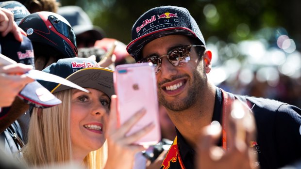 Daniel Ricciardo signs autographs and takes selfies at the Australian Formula One Grand Prix. 