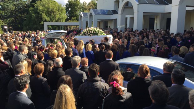 Masa's coffin leaves the funeral service in Springvale.