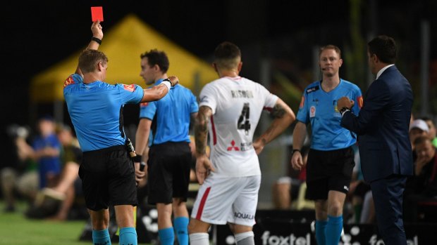What a VARce: Western Sydney Wanderers' Josh Risdon looks on in disbelief as another red card is brandished on Saturday night.