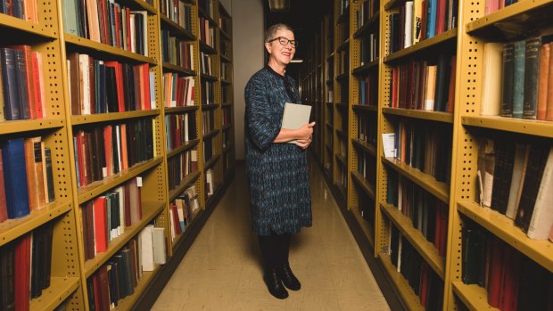 Dr Marie-Louise Ayres in the underground area of the National Library known as the Stacks where books are housed. 