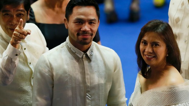 Busy man: Manny Pacquiao poses with Philippine vice-president Leni Robredo. Pacquiao's commitments in the Philippine senate complicate scheduling for a rematch with Jeff Horn.