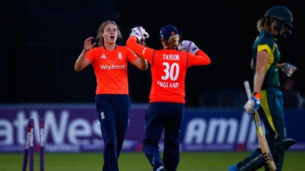 Natalie Sciver of England celebrates the wicket of Ellyse Perry at Chelmsford.
