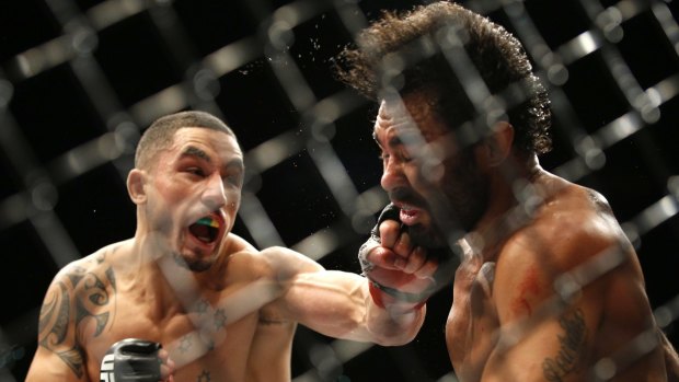 Winning streak: Robert Whittaker hits Rafael Natal during what became his fifth straight win in the UFC.