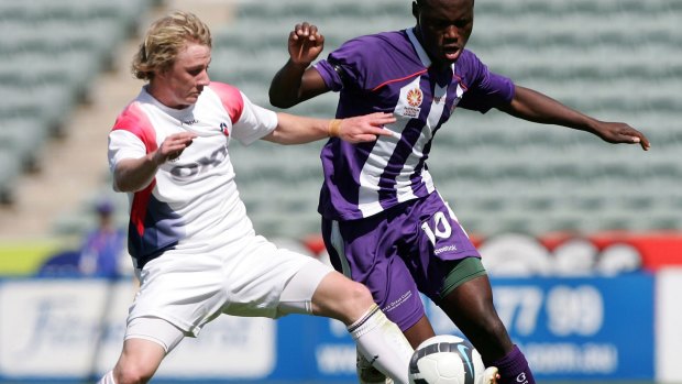 Million Butshiire (right) in action during his days with the Perth Glory youth team.