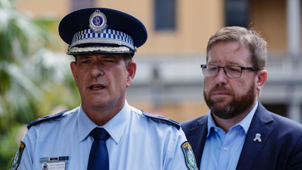 Acting Commissioner David Hudson and Police Minister Troy Grant outside St Vincent's hospital on Saturday.