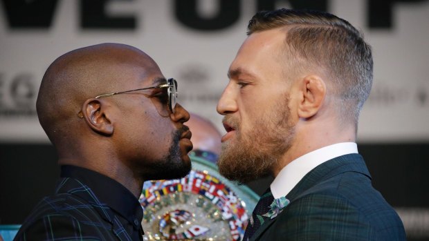 Floyd Mayweather jnr, left, and Conor McGregor during a news conference on Wednesday in Las Vegas.