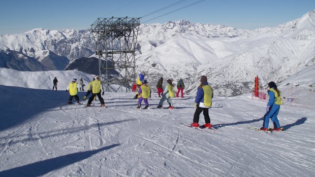 A ski school goes down a slope at Les Deux Alpes in the French Alps. An avalanche hit a group of school children on the black-rated Bellecombe piste on Wednesday, killing a 14-year-old student.
