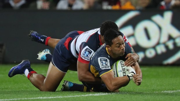 Over he goes: Christian Lealiifano touches down for the Brumbies.