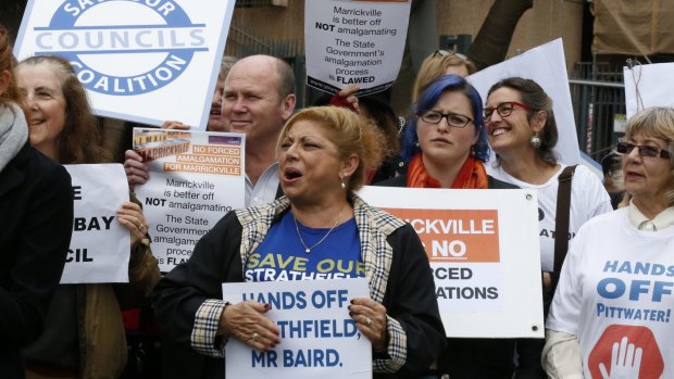 Protesters rally against forced amalgamations.
