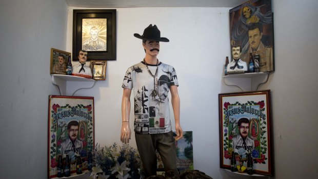 A mannequin dressed as Jesus Malverde, known in Mexico as the "Saint" of drug traffickers, stands in a shrine full of Malverde images set up by a faith healer who lives nearby in Mexico City.