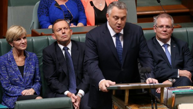Foreign Affairs Minister Julie Bishop, Prime Minister Tony Abbott and Social Services Minister Scott Morrison listen as Treasurer Joe Hockey hands down the Budget. 