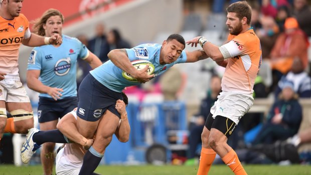 Hands off: Waratahs star Israel Folau on the charge against the Cheetahs.