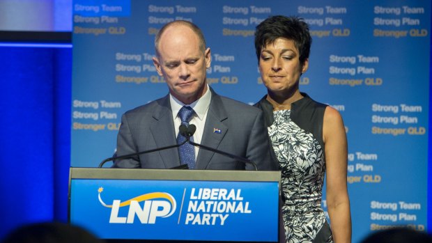 Former Premier Campbell Newman with his wife Lisa in front of supporters on the night of his election defeat.