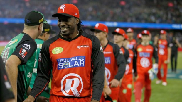 Chris Gayle of the Melbourne Renegades shakes hand with the Melbourne Stars players.