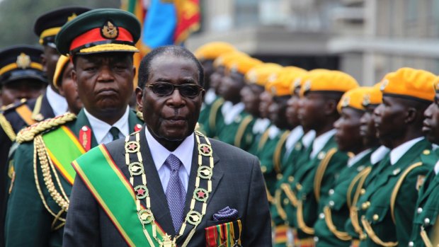 Zimbabwan President Robert Mugabe inspects the guard of honour in 2009. Shrewd and ruthless, he managed to stay in power despite advancing age, growing opposition, international sanctions and the dissolving economy of a once-prosperous African nation. 