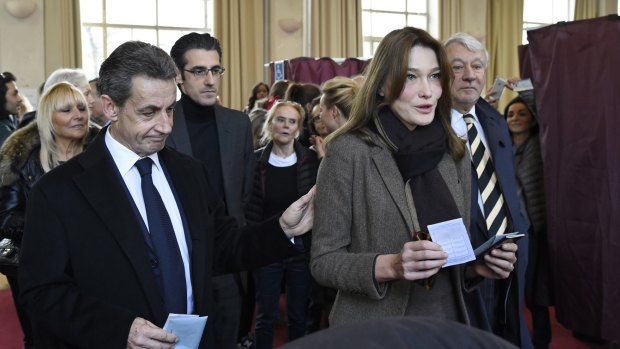 Former French president and current opposition leader Nicolas Sarkozy and former first lady Carla Bruni-Sarkozy in Paris last Sunday. 