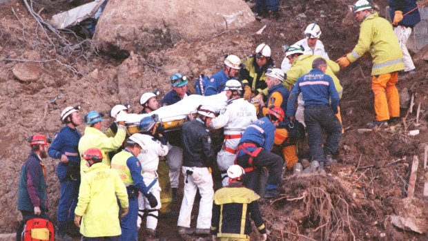 Rescue workers carry Stuart Diver to a waiting ambulance