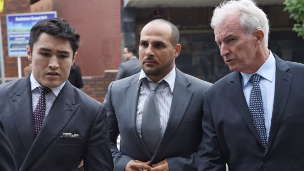 Toughest time: Hazem El Masri, centre, with lawyers Bryan Wrench, left, and Chris Murphy at Bankstown Local Court.