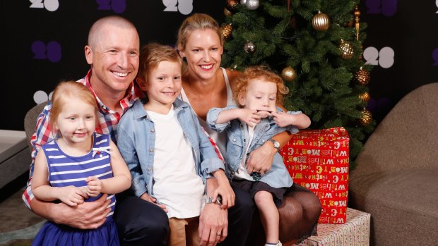 Family man: Brad and Karina Haddin pose for a photo with their children Mia, Zac and Hugo last year.
