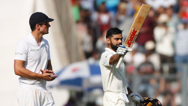 Alastair Cook applauds Virat Kohli's century on the third day of the fourth Test.