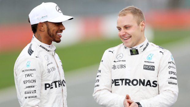 Valtteri Bottas, right, shares a joke with Lewis Hamilton. 