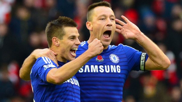Cesar Azpilicueta and John Terry celebrate a 2-1 win over Liverpool at Anfield.