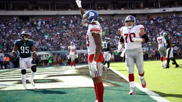 New York Giants' Odell Beckham raises his fist after a touchdown during an NFL  game against the Philadelphia Eagles on Sunday.