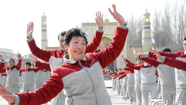 Hundreds of people in matching outfits, both Uighur and Han, lined up in a co-ordinated square dance organised by Chinese authorities in Xinjiang in February.