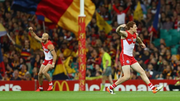 On the comeback trail: Jarrad McVeigh and Gary Rohan celebrate a goal during the Sydney Swans' playoff win over the Adelaide Crows at the Sydney Cricket Ground.